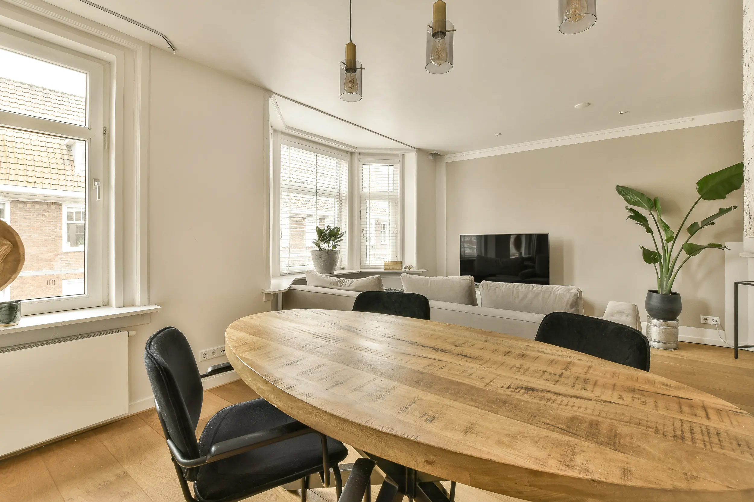 50963970_a-living-room-with-a-table-and-a-living-room-2500px